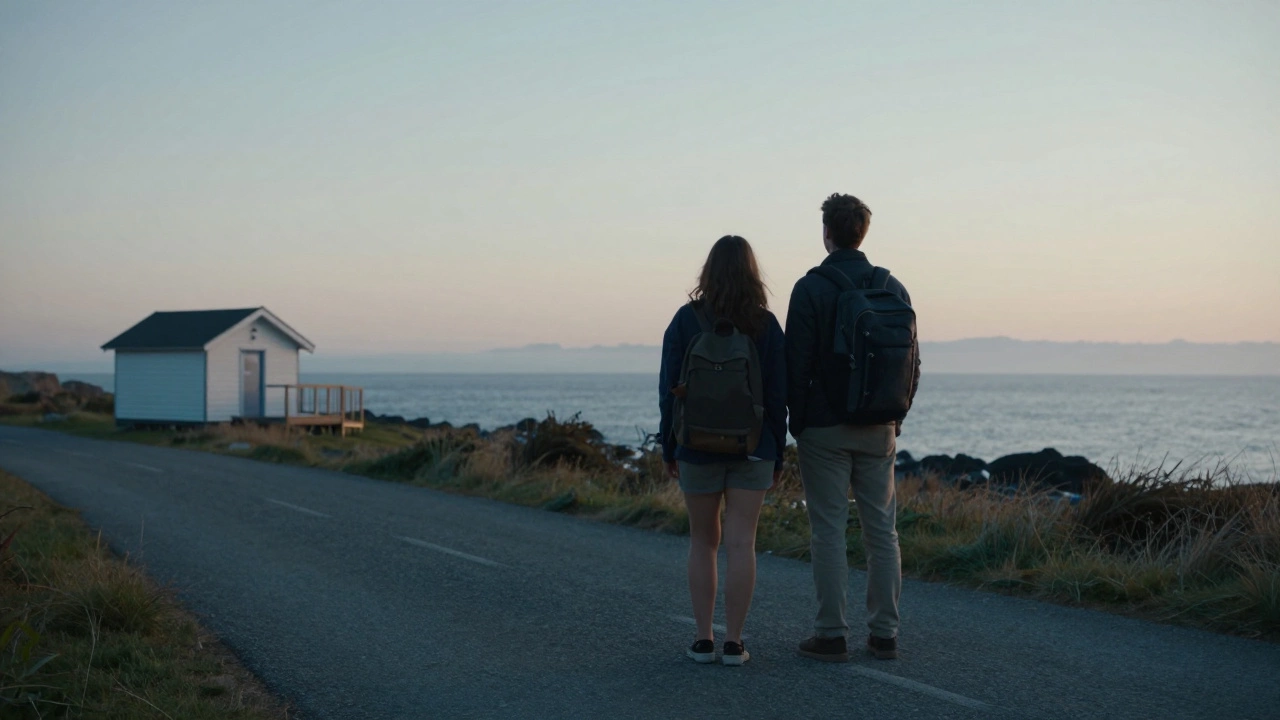 Couple walking toward a simple seaside cabin at sunrise